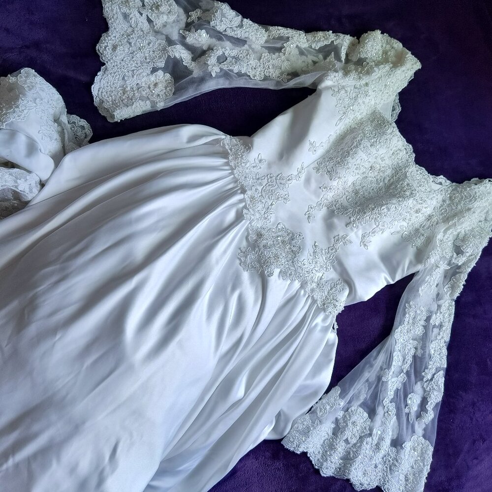 Elegant long sleeve traditional wedding dress with long train, size 10 $500
